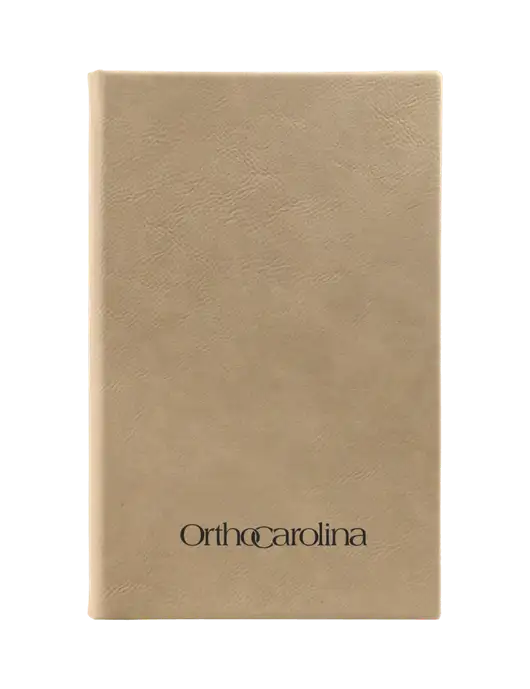 Tan Leatherette 5.25 x 8.25 Journal w/OrthoCarolina Logo