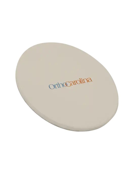 Round Sandstone Coaster w/OrthoCarolina Logo