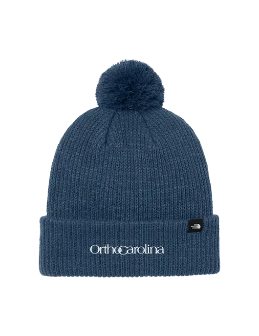 The North Face Light Navy Pom Beanie w/OrthoCarolina Logo